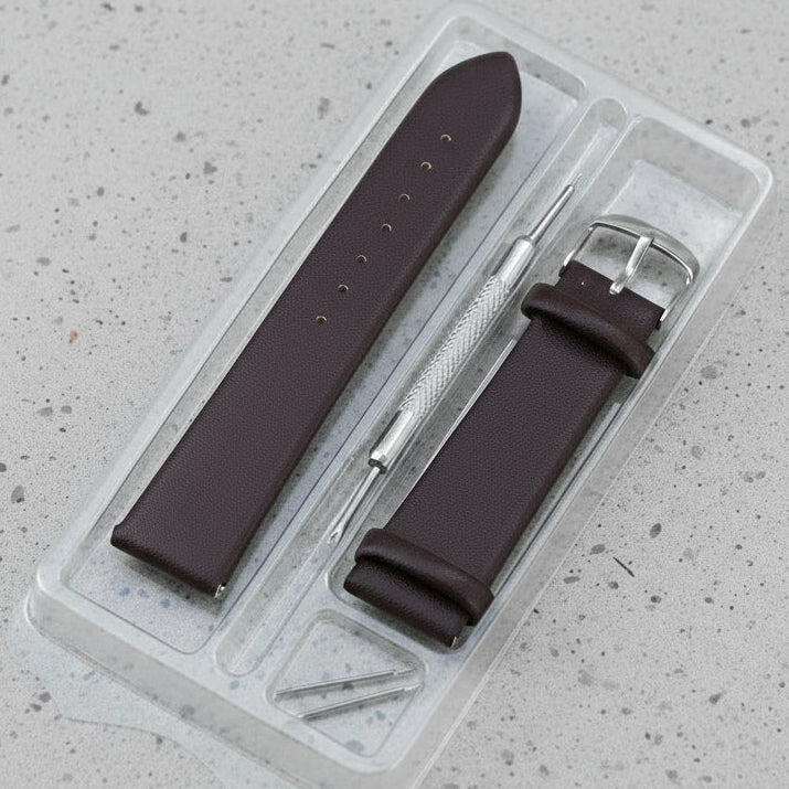 Brown leather watch strap with tool in clear plastic