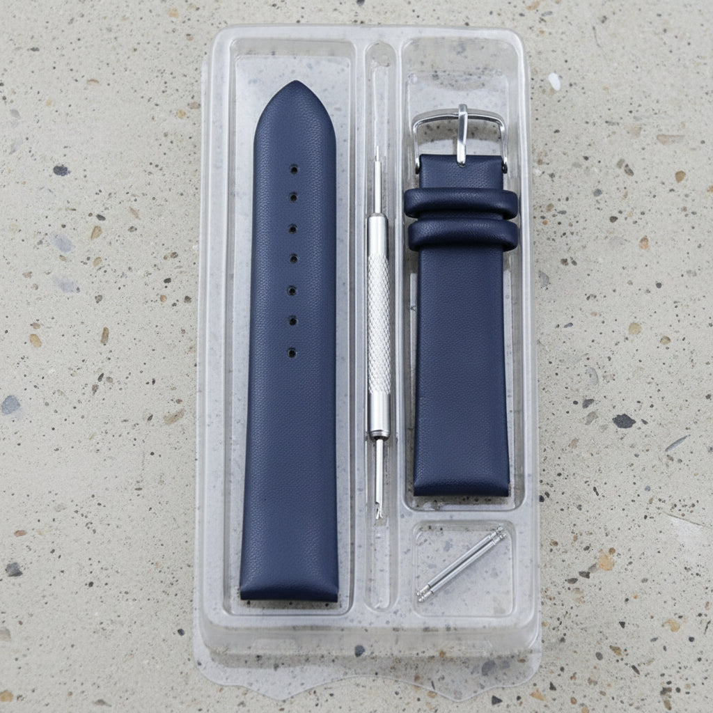 Blue leather watch strap set with tools in a clear plastic case 