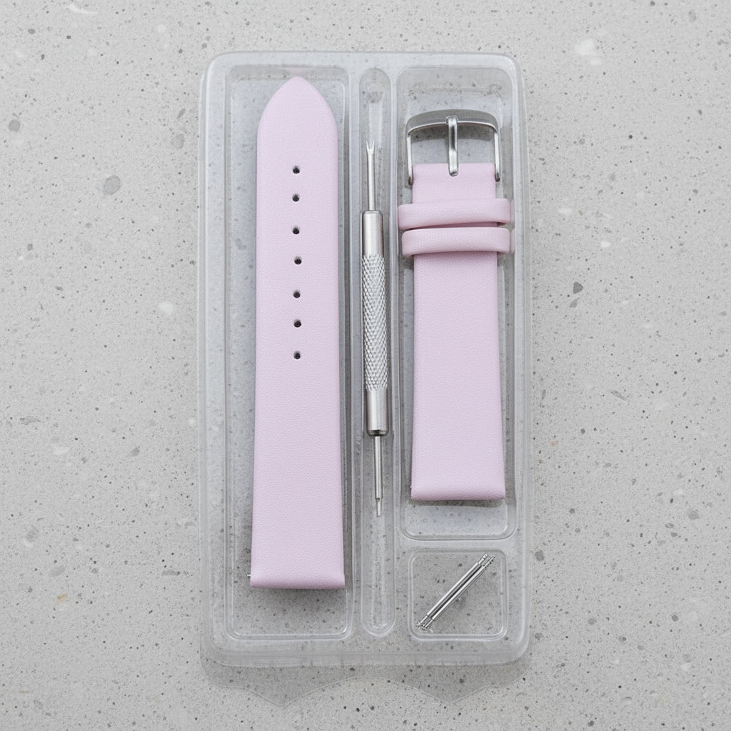 Pink leather watch strap with tools in a clear plastic case 