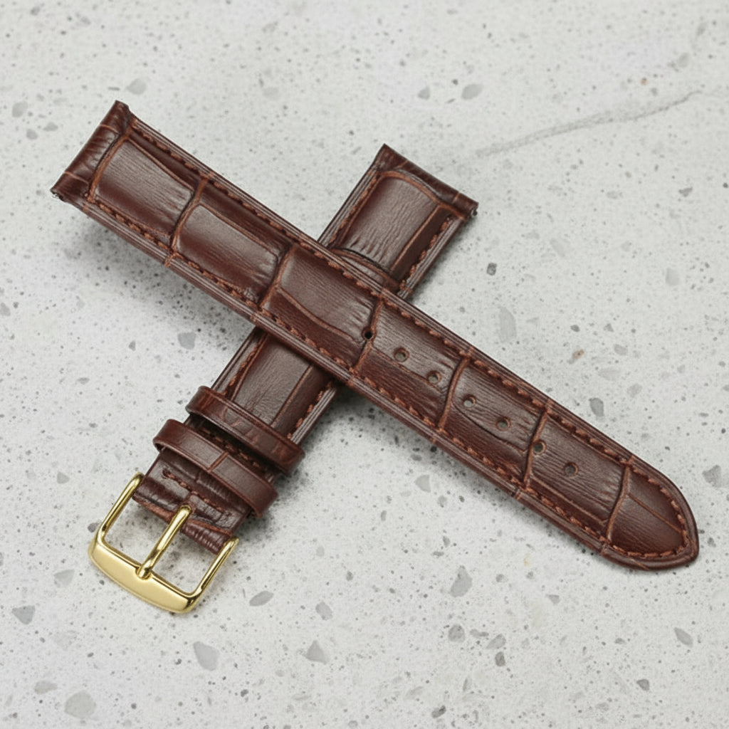 Brown leather watch strap with gold buckle