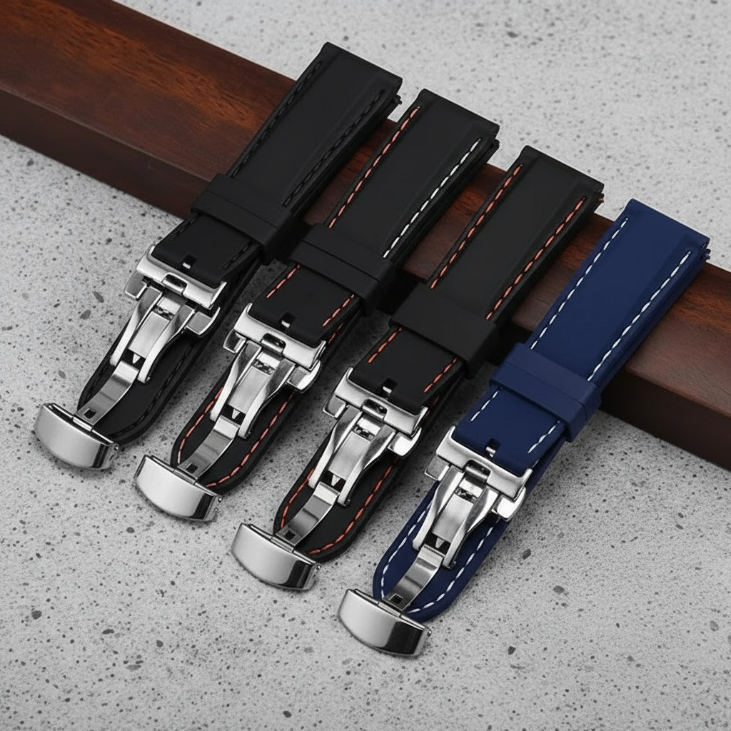 Set of black and blue rubber watch straps with metal butterfly clasps