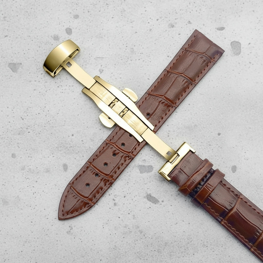 Brown crocodile-patterned watch strap with gold butterfly clasp 