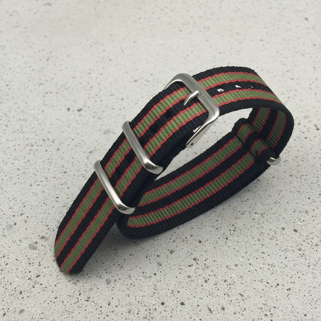 Black, red, and green striped nylon watch strap with silver buckle 